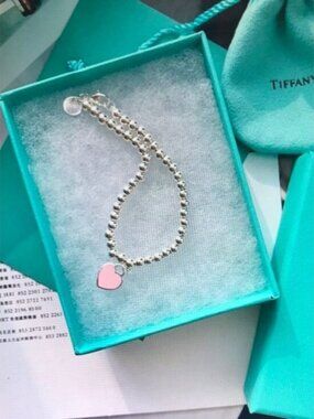 Tiffany & Co. Silver Beaded Bracelet with Pink Heart Charm